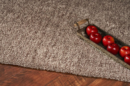 5' X 7' Beige And Brown Abstract Shag Hand Woven Area Rug