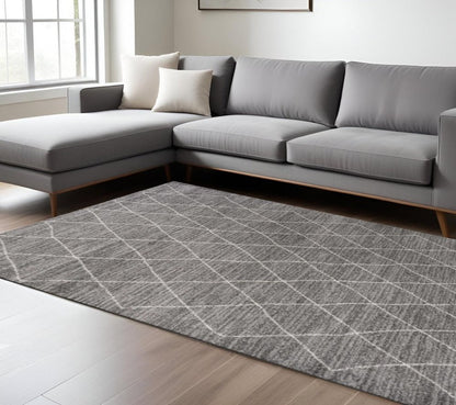 5' X 8' Gray And Ivory Geometric Area Rug