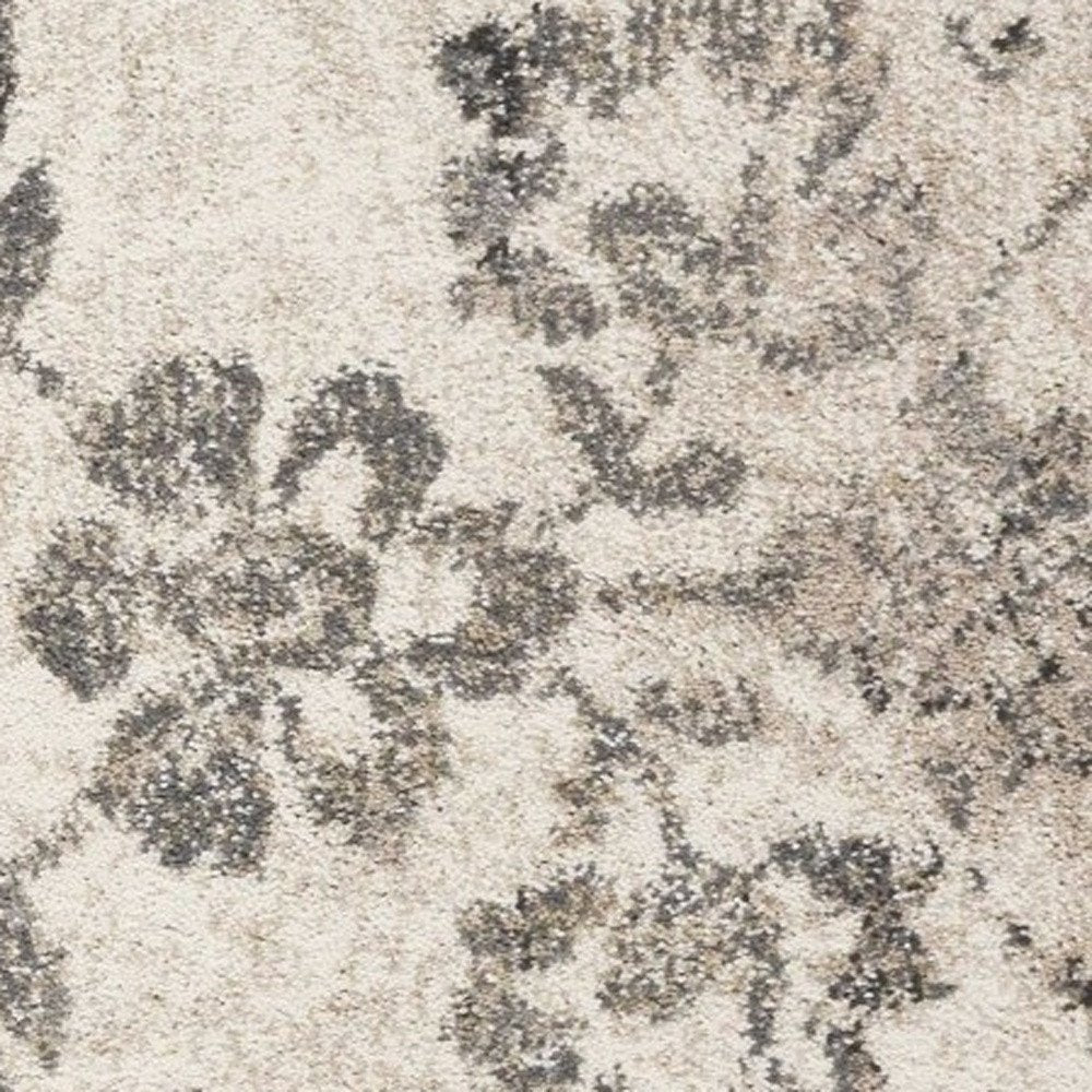5' X 8' Gray And Tan Floral Distressed Area Rug