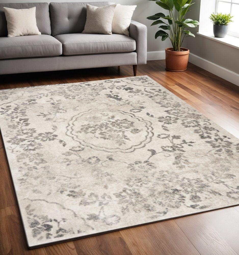 5' X 8' Gray And Tan Floral Distressed Area Rug
