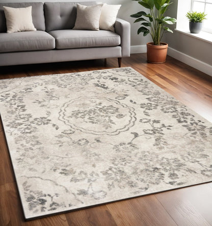 5' X 8' Gray And Tan Floral Distressed Area Rug