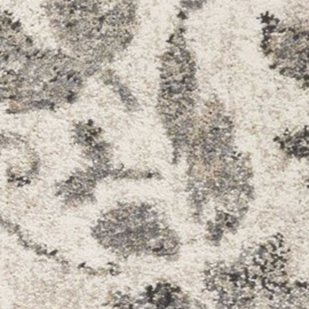 5' X 8' Gray And Tan Floral Distressed Area Rug