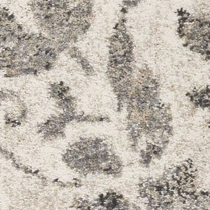 5' X 8' Gray And Tan Floral Distressed Area Rug