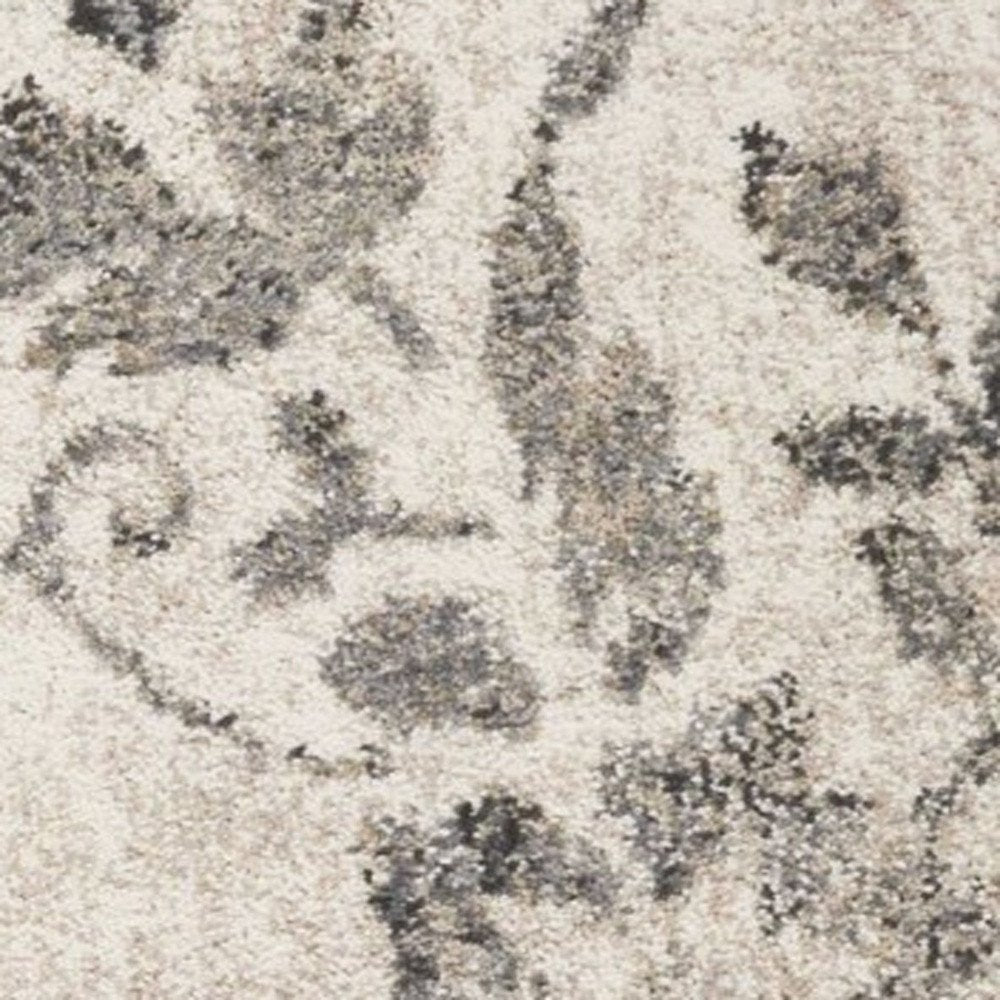 5' X 8' Gray And Tan Floral Distressed Area Rug
