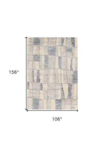 5' X 8' Ivory And Blue Abstract Area Rug