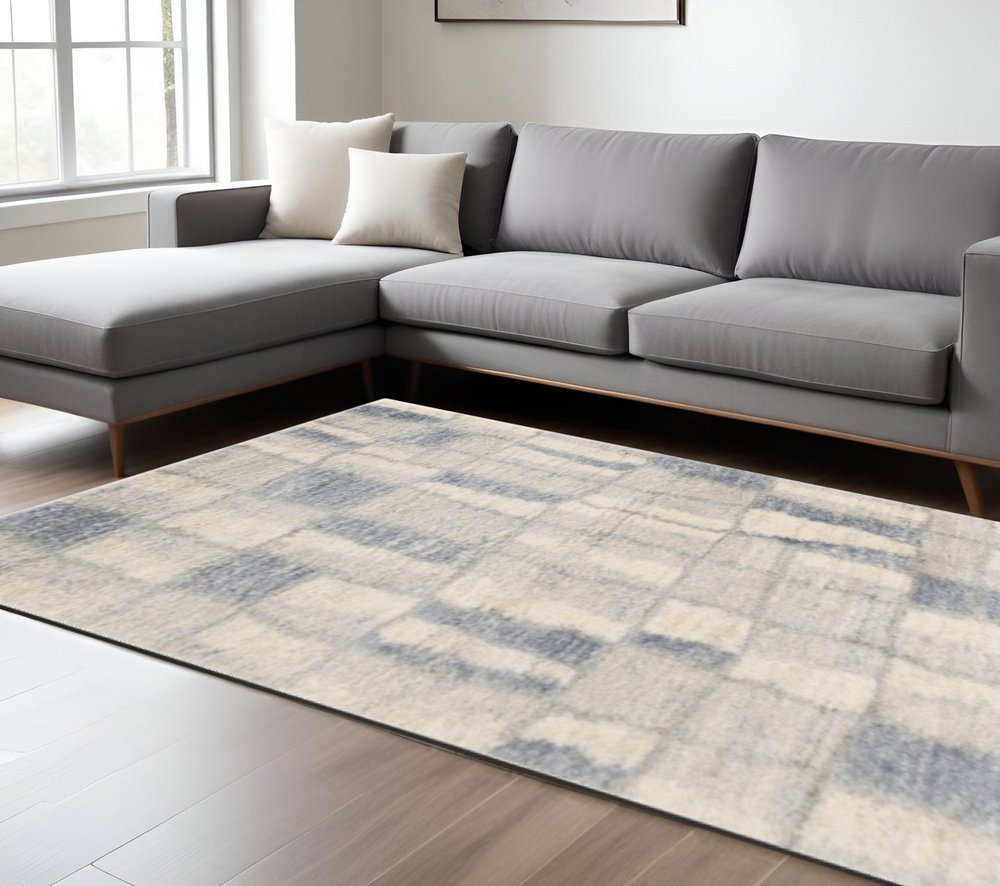 9' X 13' Ivory And Blue Abstract Geometric Area Rug
