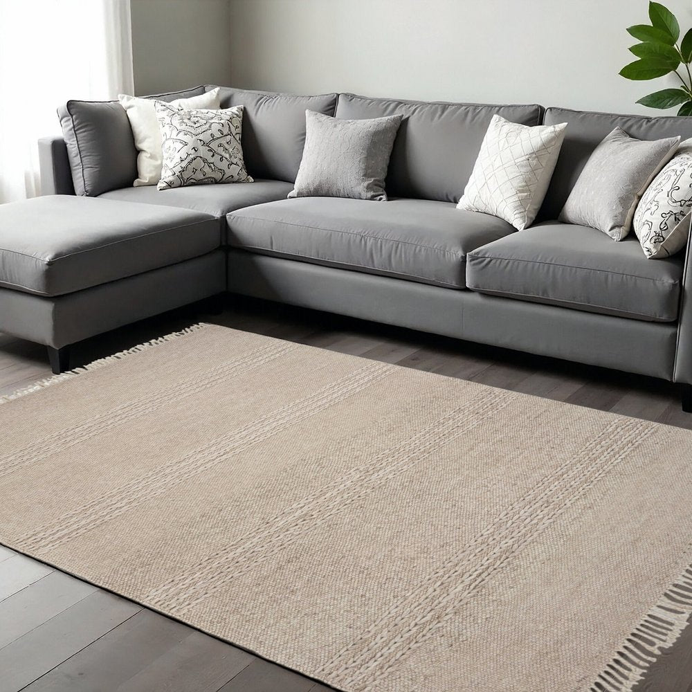 5' X 8' Beige Wool Hand Woven Area Rug With Fringe