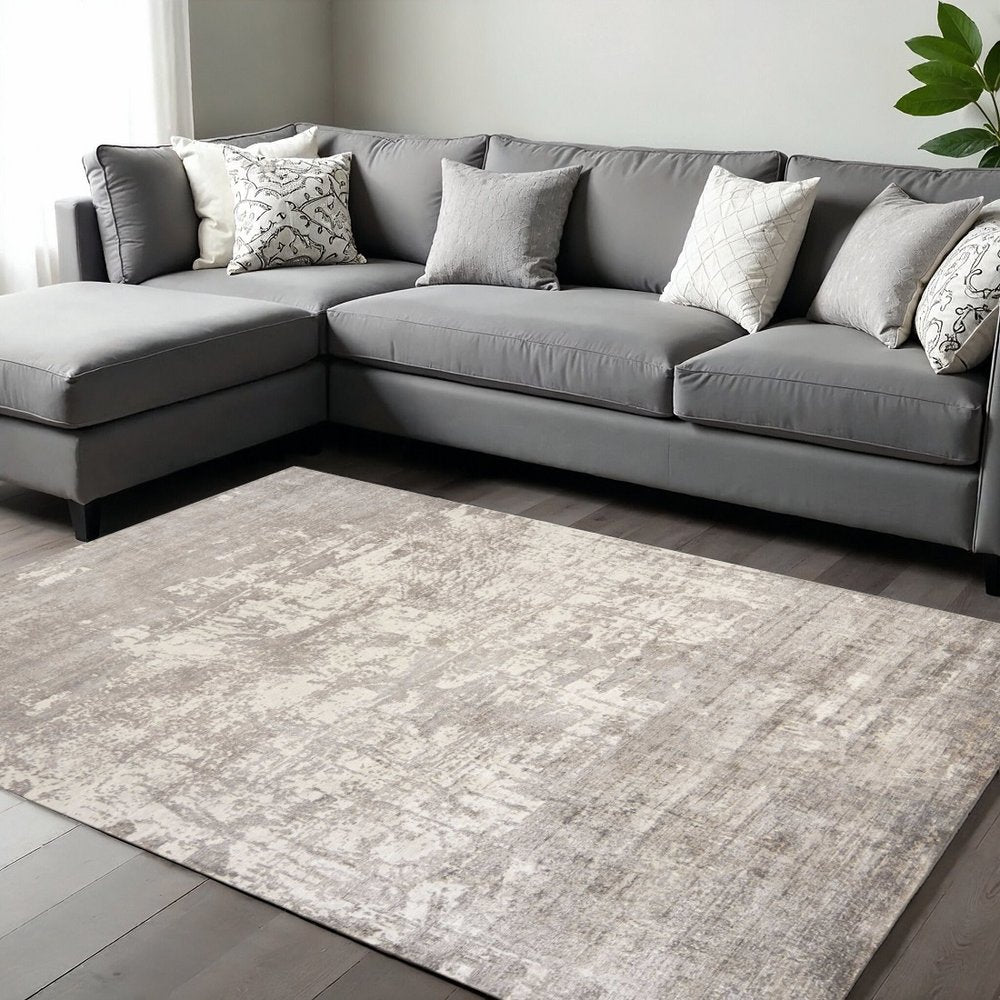 7' X 10' Beige And Ivory Abstract Hand Loomed Area Rug