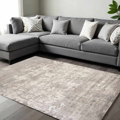 7' X 10' Beige And Ivory Abstract Hand Loomed Area Rug