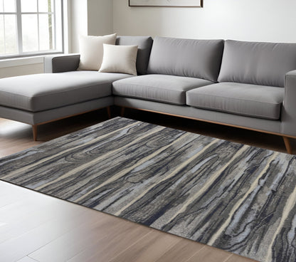 8' X 11' Gray Blue And Black Abstract Area Rug