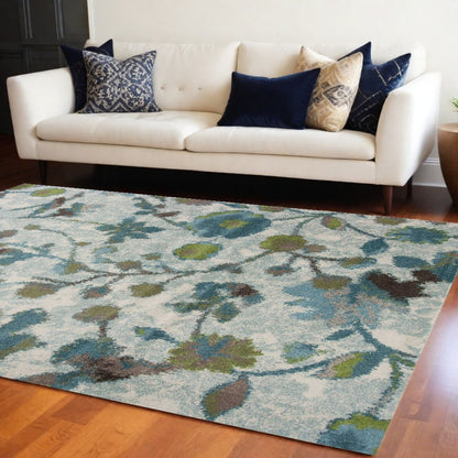 10' X 13' Teal Blue White And Green Floral Vines Area Rug