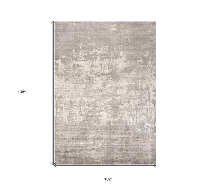 7' X 10' Beige And Ivory Abstract Hand Loomed Area Rug