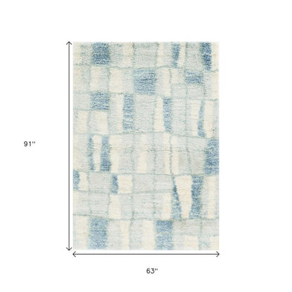 9' X 13' Ivory And Blue Abstract Geometric Area Rug