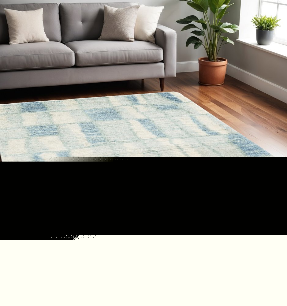 5' X 8' Ivory And Blue Abstract Area Rug
