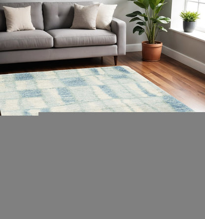 5' X 8' Ivory And Blue Abstract Area Rug
