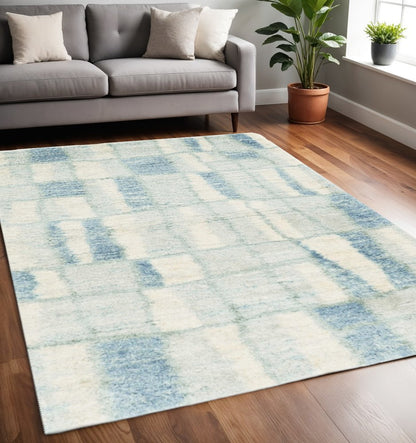 9' X 13' Ivory And Blue Abstract Geometric Area Rug