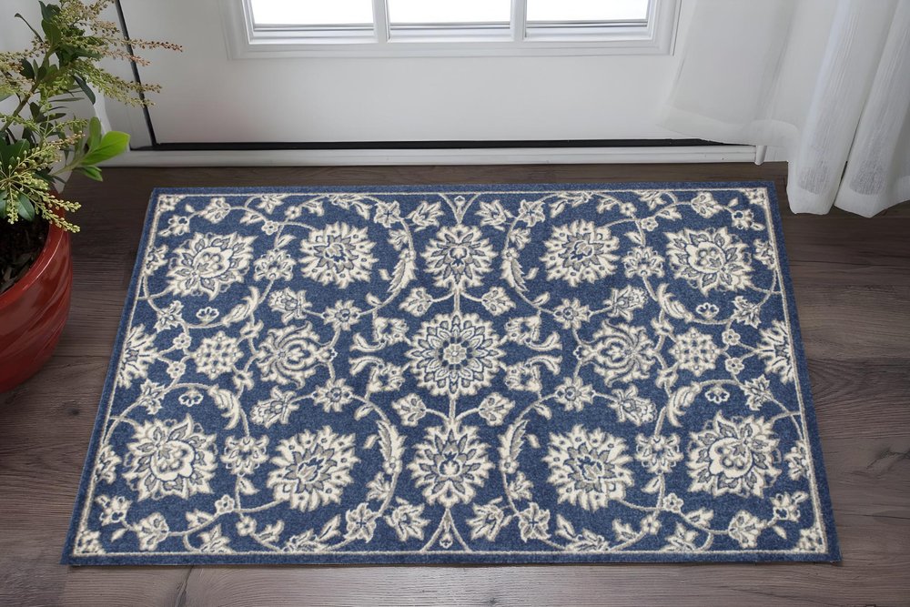 5' X 8' Blue And Ivory Floral Medallion Area Rug