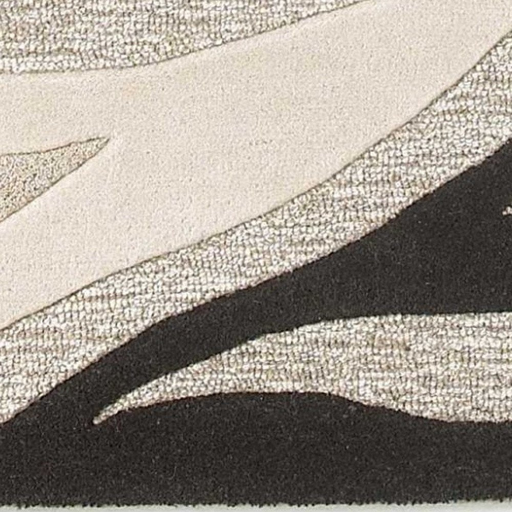 2' X 4' Beige Ivory And Black Wool Abstract Hand Tufted Area Rug
