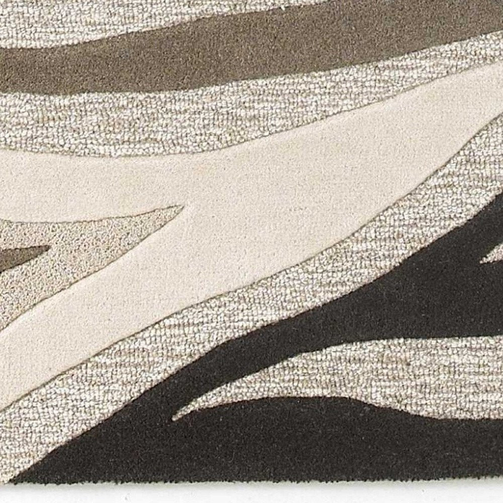 2' X 4' Beige Ivory And Black Wool Abstract Hand Tufted Area Rug