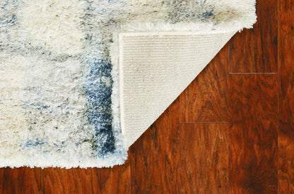 4' X 6' Ivory And Blue Abstract Geometric Distressed Area Rug
