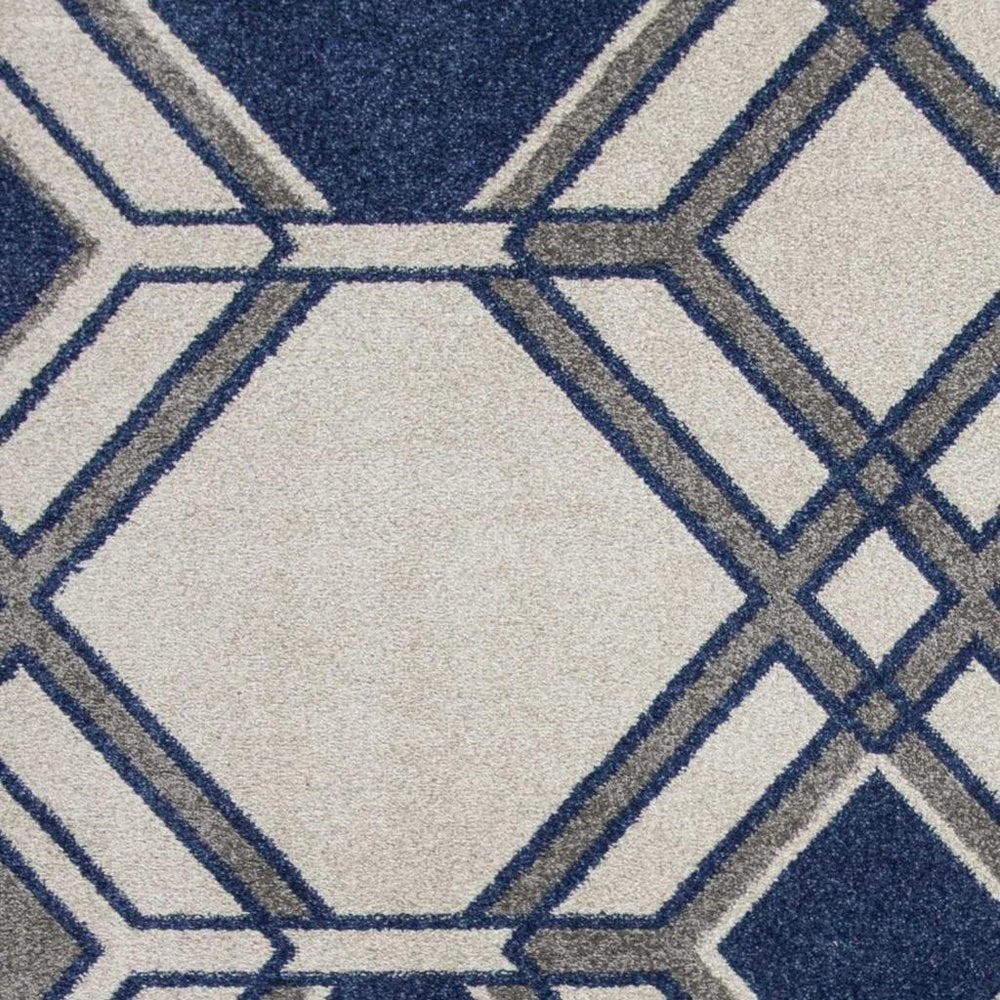 5' X 8' Blue Ivory And Gray Geometric Area Rug