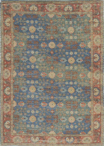 7' X 9' Blue Red And Beige Floral Medallion Hand Woven Area Rug