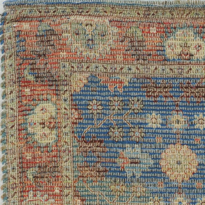 7' X 9' Blue Red And Beige Floral Medallion Hand Woven Area Rug