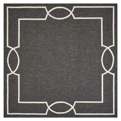 7' X 10' Onyx And White Geometric Handmade Indoor Outdoor Area Rug