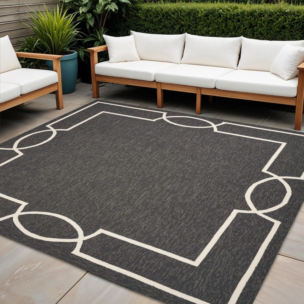 7' X 10' Onyx And White Geometric Handmade Indoor Outdoor Area Rug