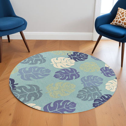 7' Turquoise And Ivory Botanical Leaves Hand Tufted Round Rug