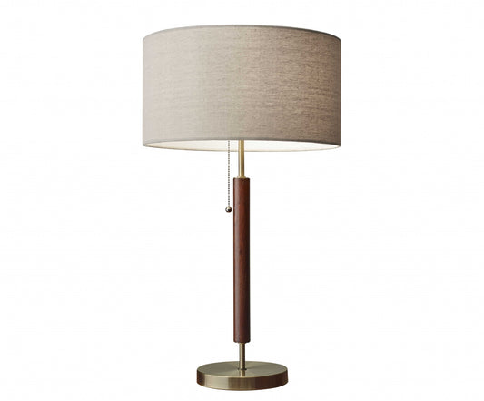 26" Antiqued Brass Solid Wood Table Lamp With Beige Drum Shade