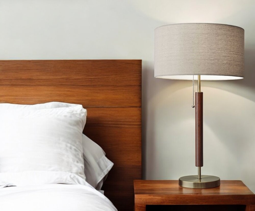 26" Antiqued Brass Solid Wood Table Lamp With Beige Drum Shade