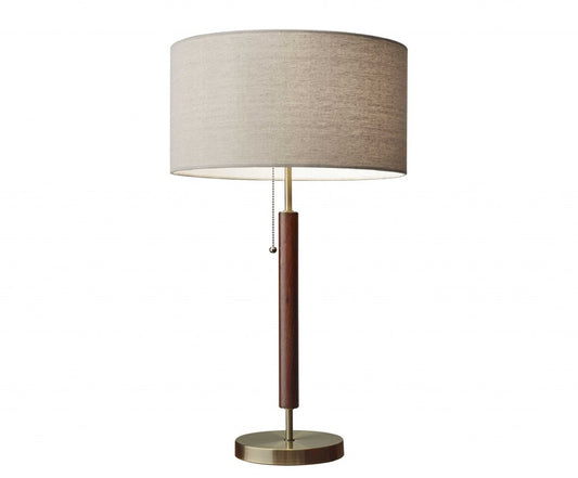 26" Antiqued Brass Solid Wood Table Lamp With Beige Drum Shade