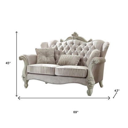 70" Bone And Gold Faux Leather Curved Loveseat