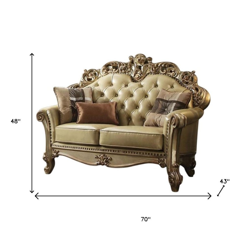 70" Bone And Gold Faux Leather Curved Loveseat
