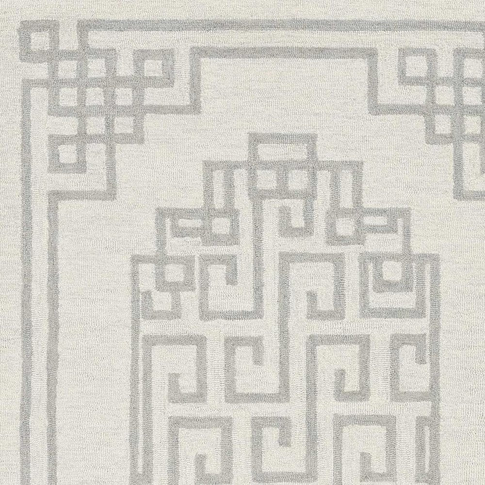 5' X 7' Ivory And Gray Wool Geometric Hand Tufted Area Rug
