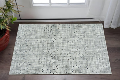 5' X 8' Gray And Black Abstract Distressed Area Rug
