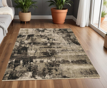 4' X 5' Charcoal Beige And Taupe Abstract Distressed Area Rug
