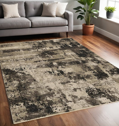 4' X 5' Charcoal Beige And Taupe Abstract Distressed Area Rug