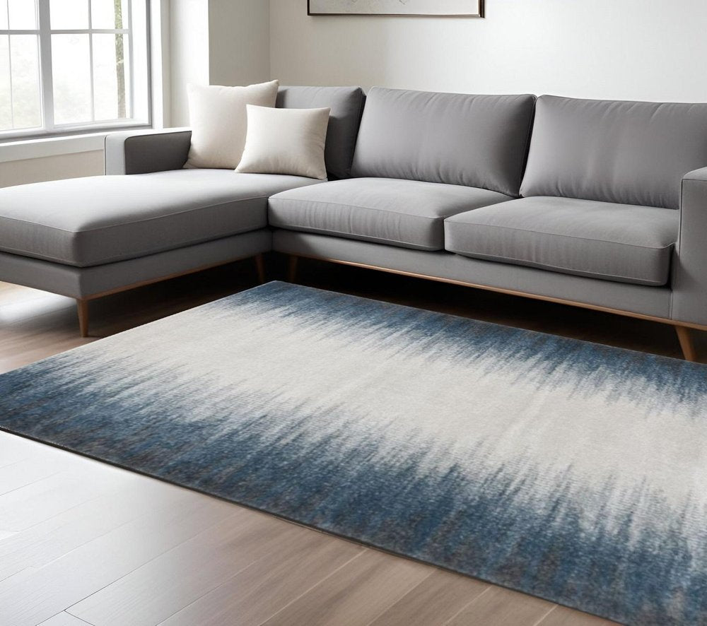 5' X 8' Ivory And Blue Abstract Area Rug