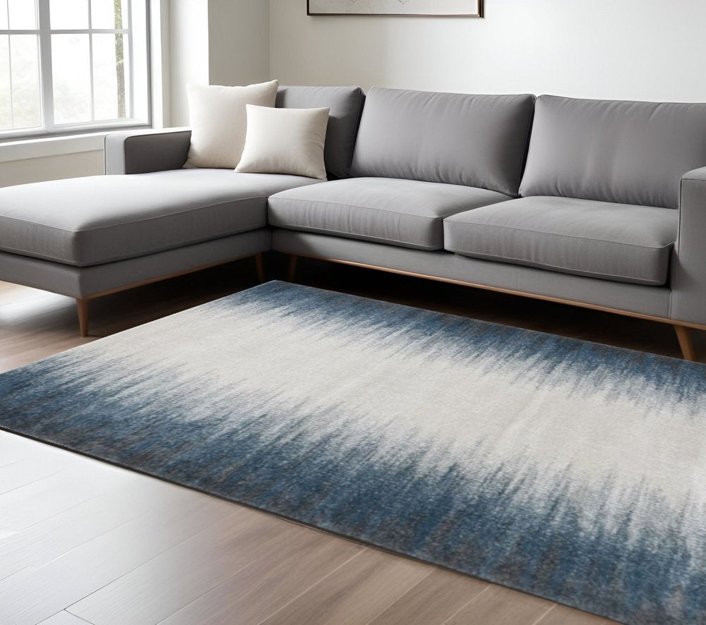 5' X 8' Ivory And Blue Abstract Area Rug