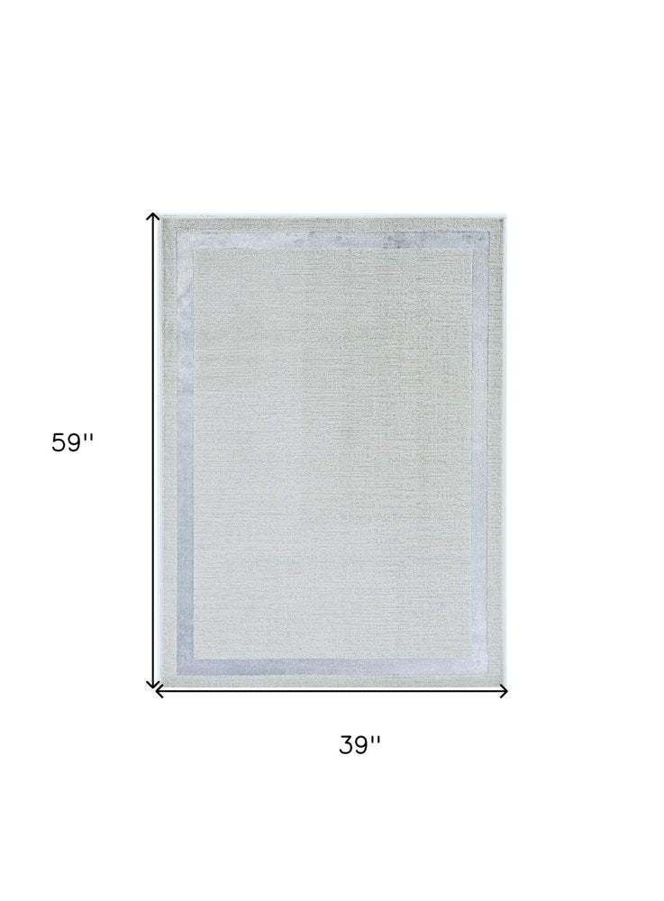 8' X 11' Ivory And Silver Abstract Area Rug