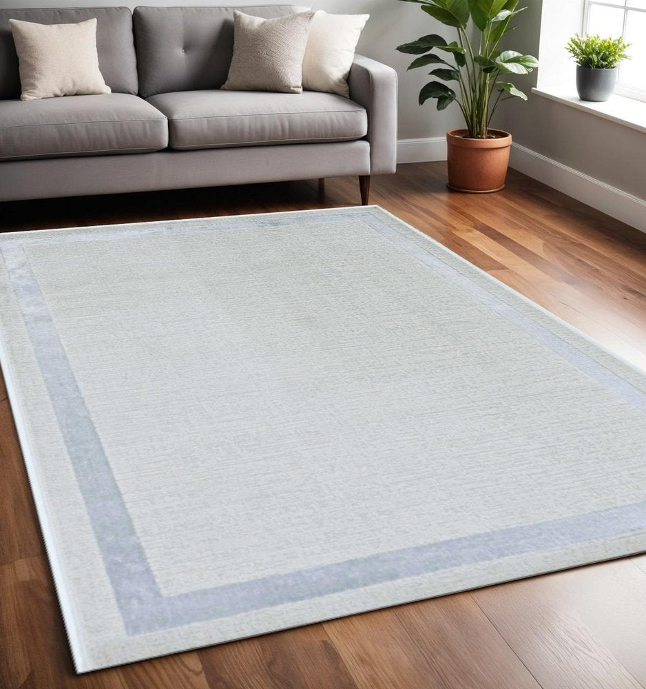 8' X 11' Ivory And Silver Abstract Area Rug