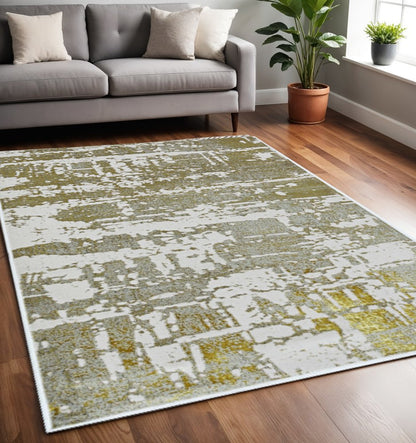 8' X 11' Ivory Taupe And Gold Abstract Area Rug