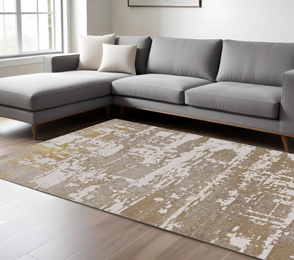 7' X 10' Ivory Taupe And Gold Abstract Area Rug
