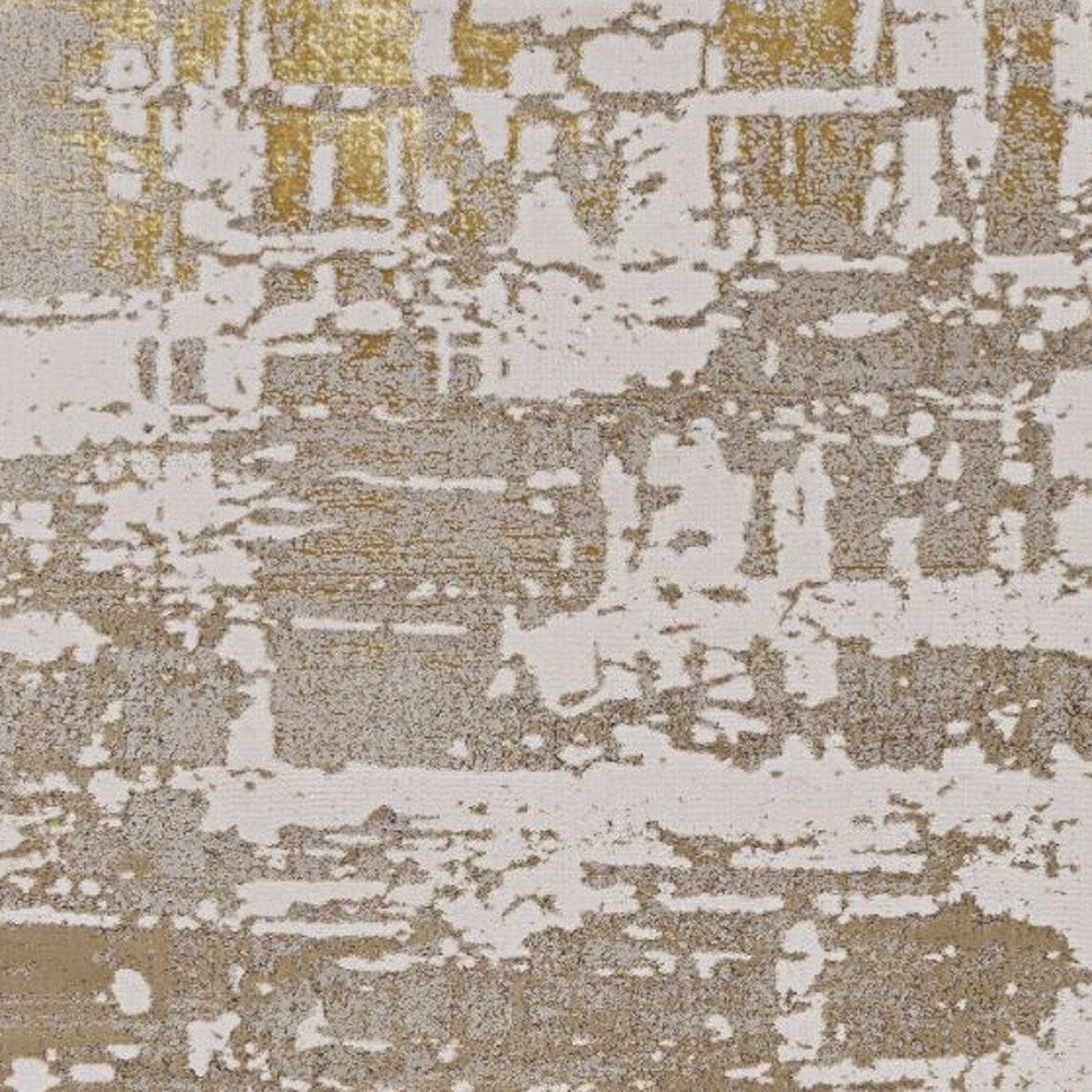 7' X 10' Ivory Taupe And Gold Abstract Area Rug