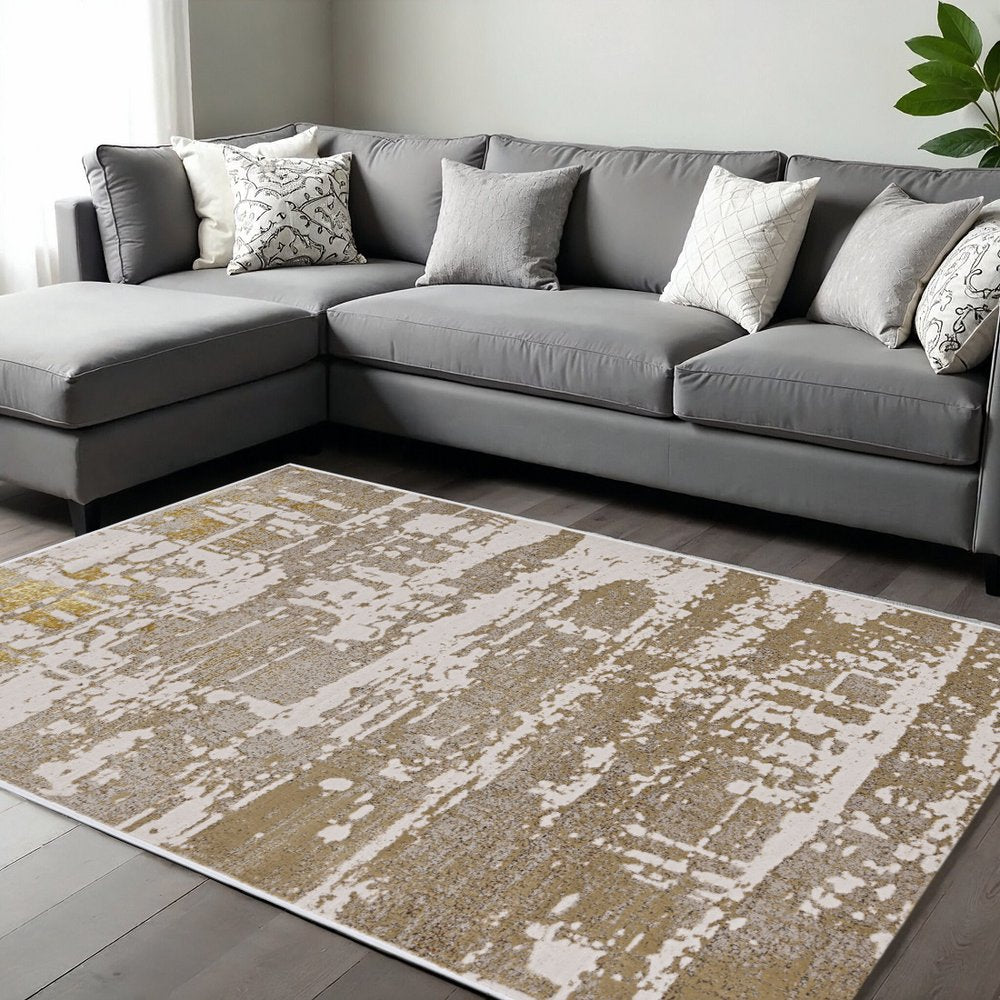 7' X 10' Ivory Taupe And Gold Abstract Area Rug