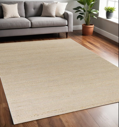 5' X 7' Tan And Ivory Hand Woven Area Rug