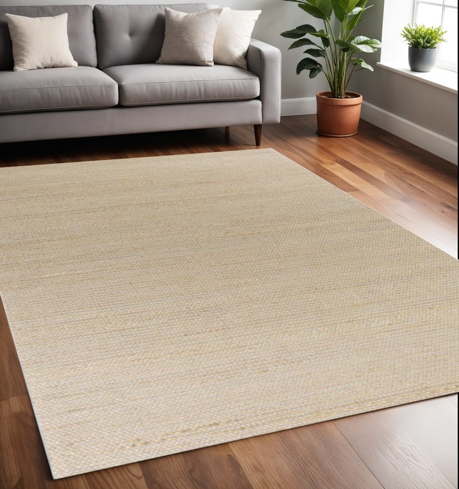 5' X 7' Tan And Ivory Hand Woven Area Rug