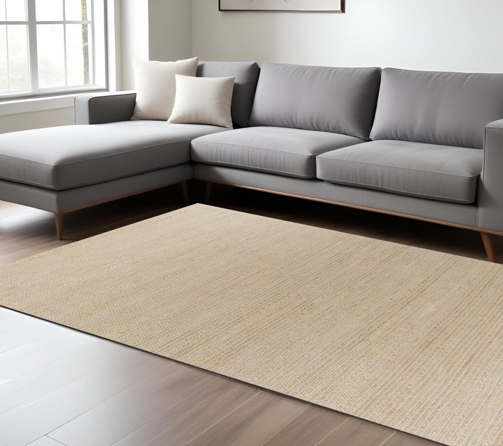 5' X 7' Tan And Ivory Hand Woven Area Rug
